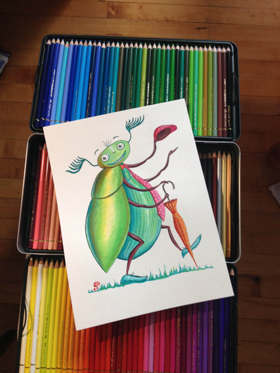 A beetle illustration for children over a box of colored pencils